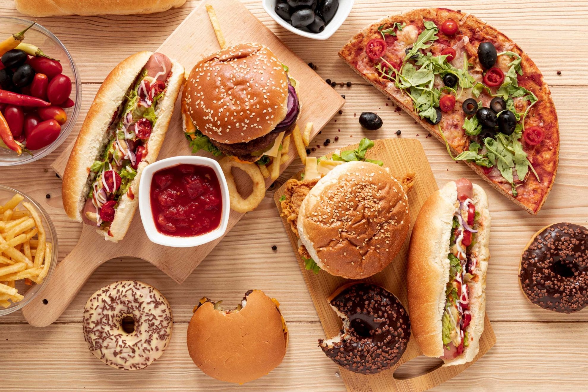 flat-lay-arrangement-with-burgers-and-pizza