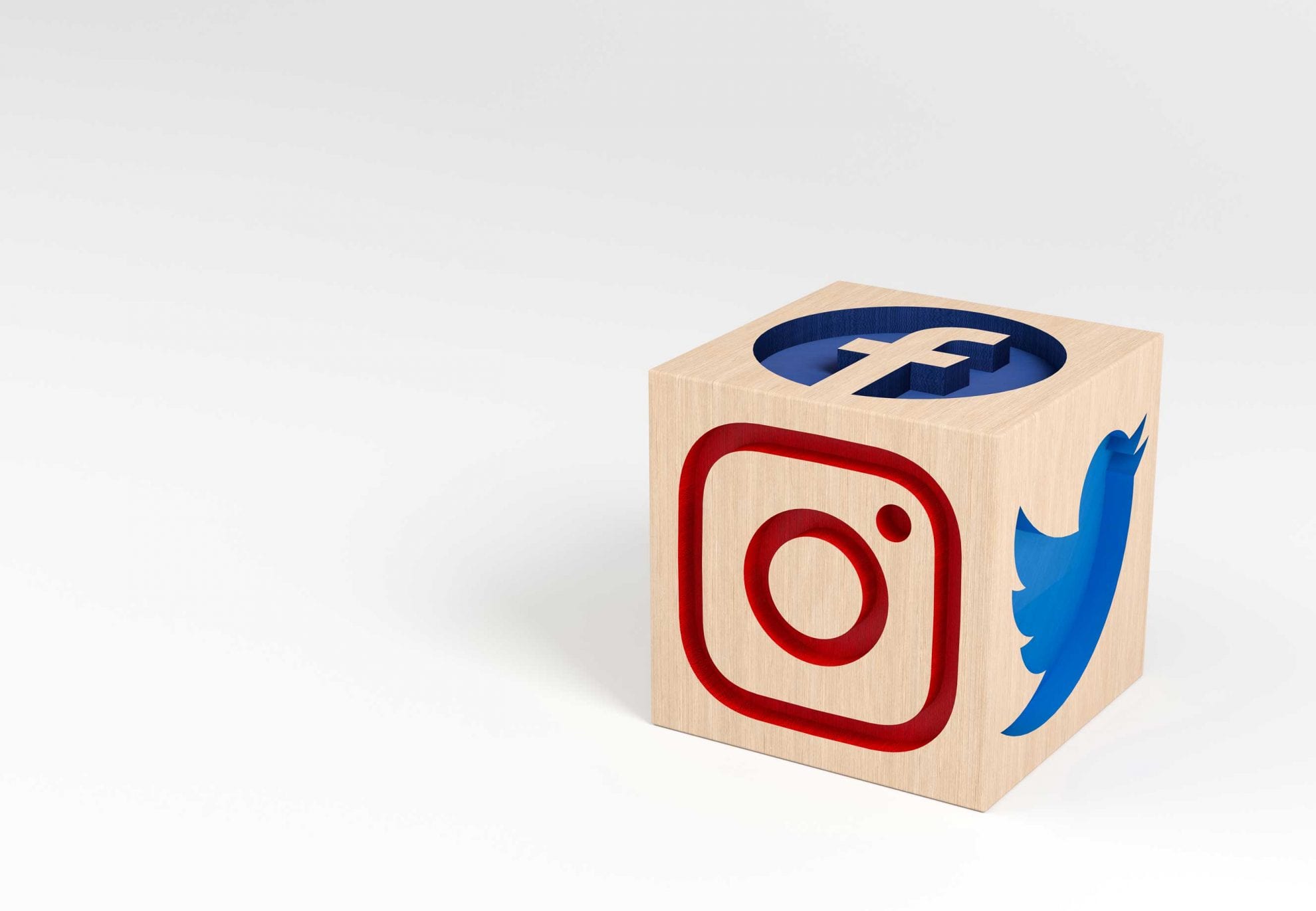 wooden-cube-with-carved-social-media-icons